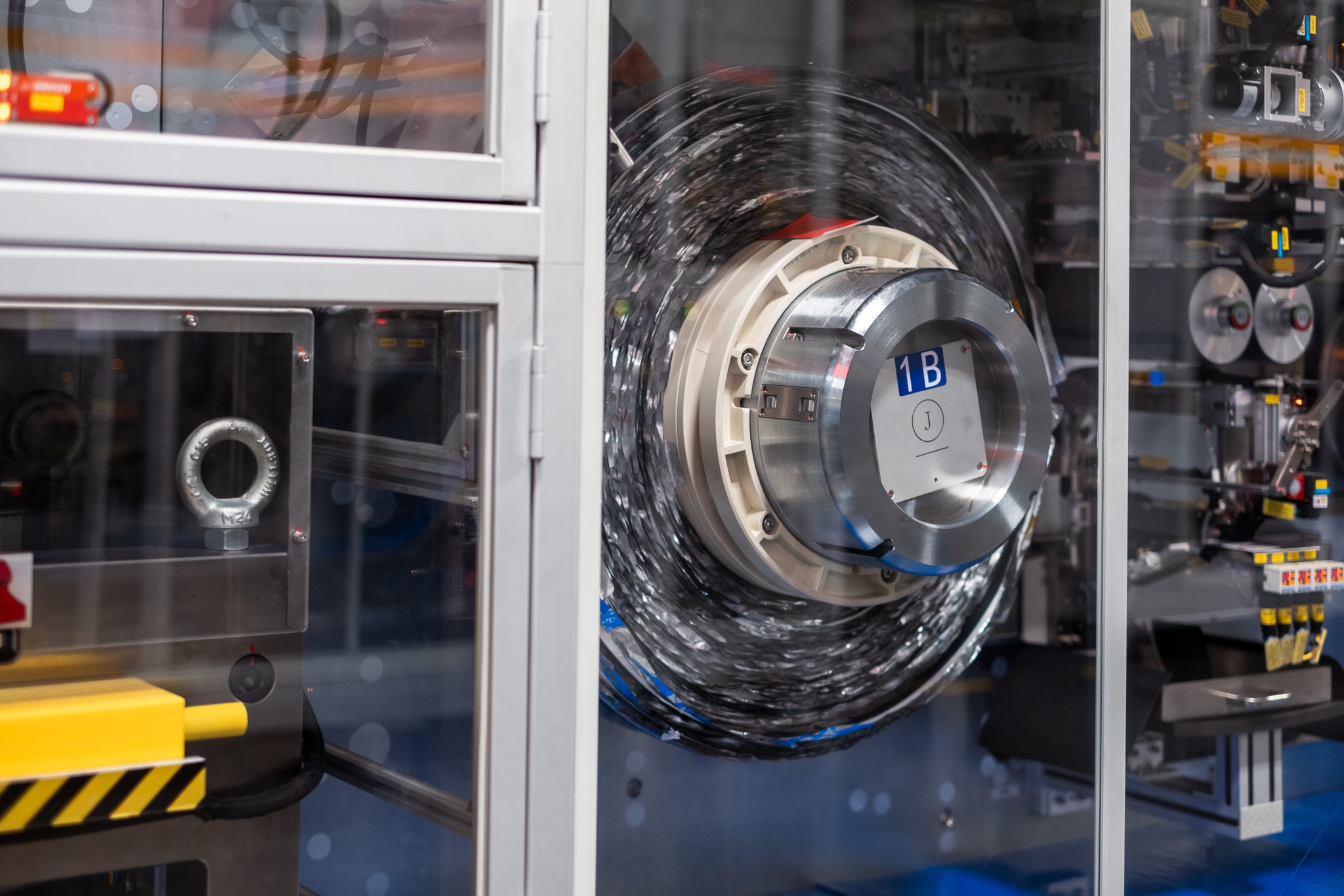 This cathode roll — pictured in a winding machine — will be wound into a jelly roll.