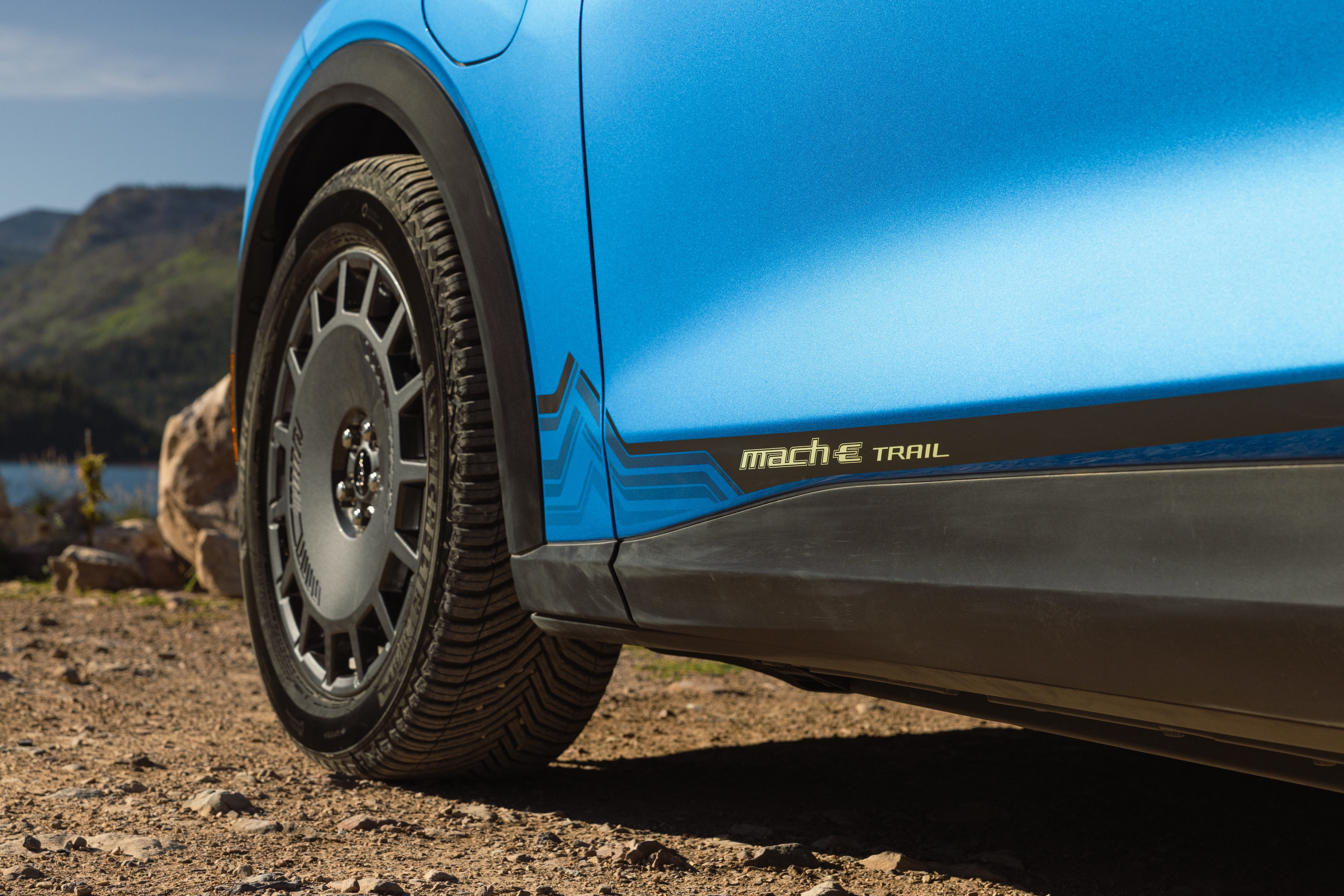 The new 2027 Mustang Mach-E Trail combines the everyday electric performance and usability customers expect and love with purpose-designed hardware for the road to the trailhead, campsite, or water.